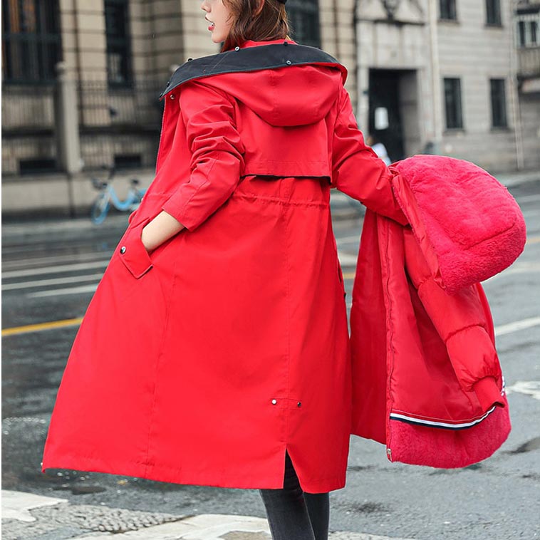 Red waterproof women's parka jacket with fur-lined hood, button front, side pockets