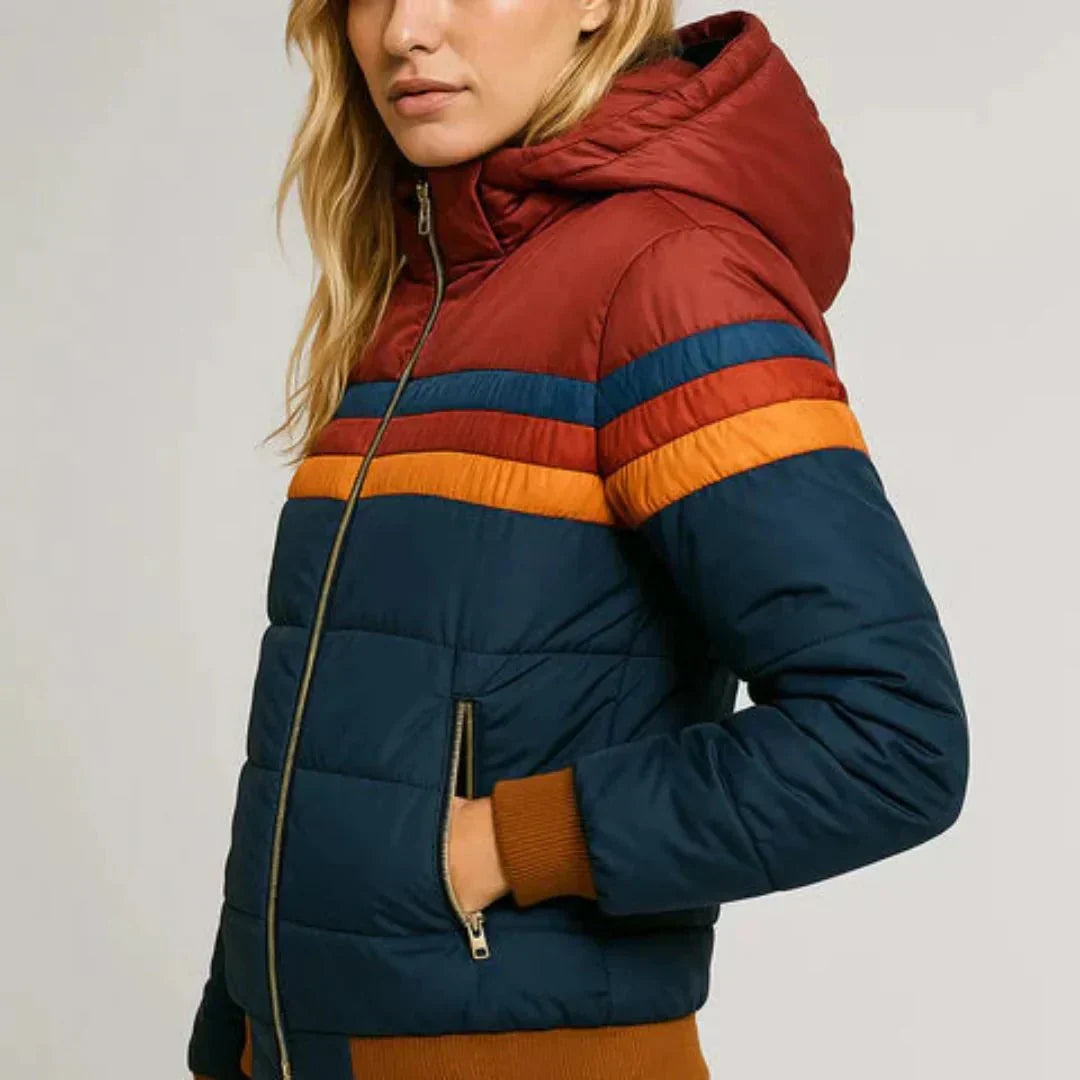 Oumani Stella waterproof rain jacket with navy sleeves, maroon hood, and striped zip front