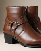 Brown leather ankle boots with side zipper, buckle strap, and block heel.