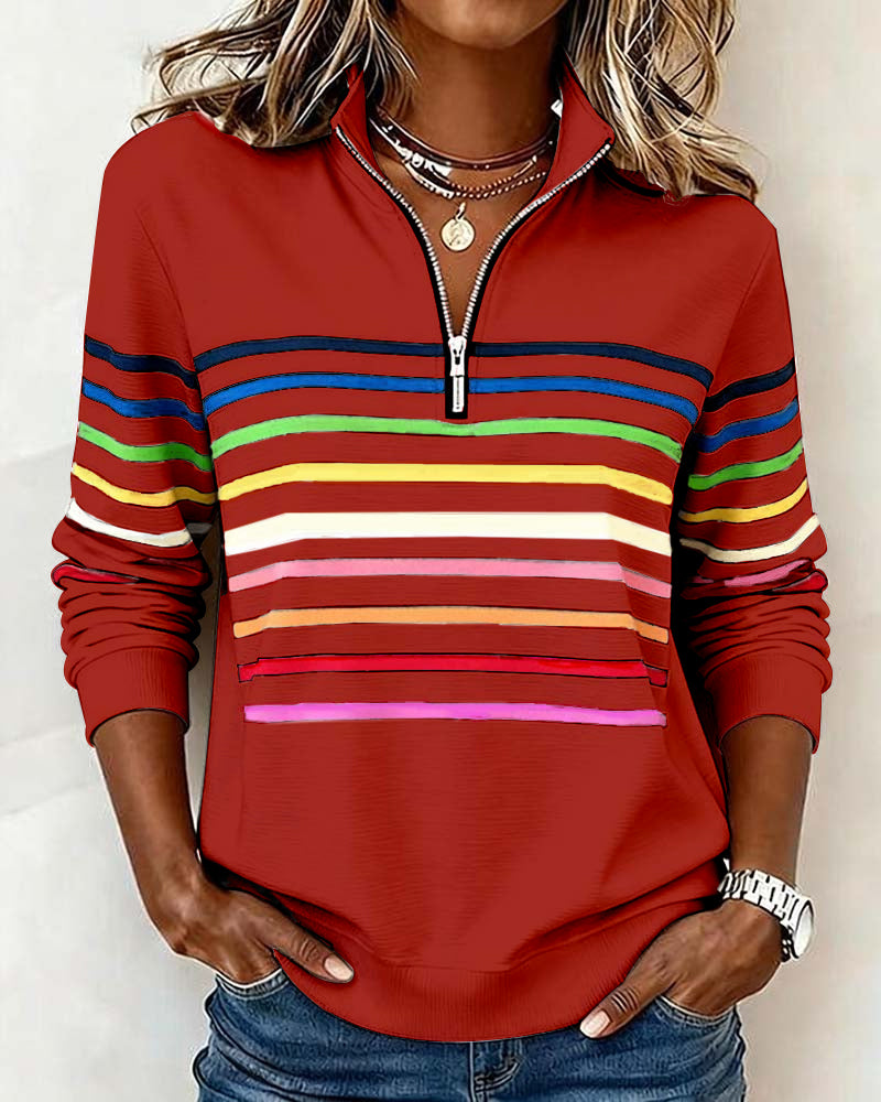 Women’s knit quarter-zip pullover in red with multicolor striped bands and ribbed cuffs.