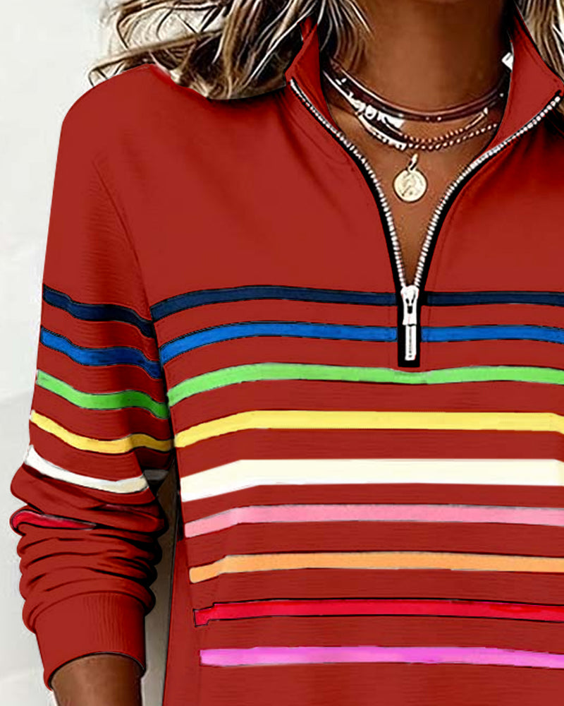 Women’s knit quarter-zip pullover in red with multicolor striped bands and stand collar zipper.