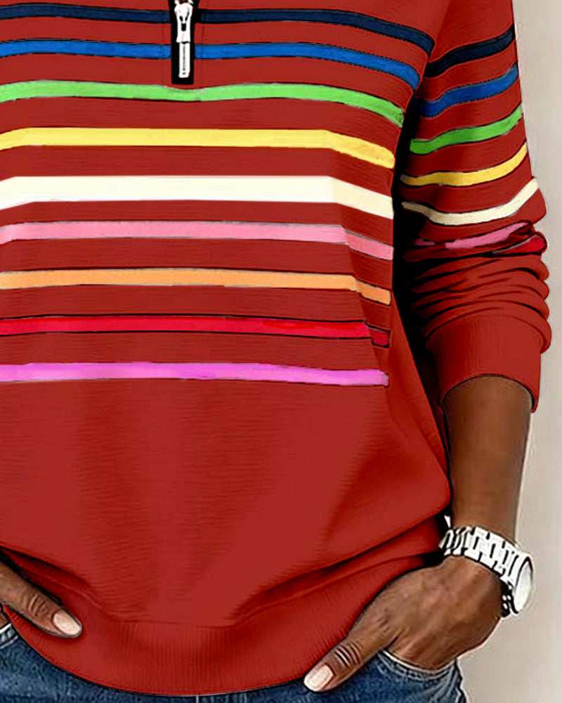Women’s red knit quarter-zip pullover with multicolor horizontal striped bands on front.