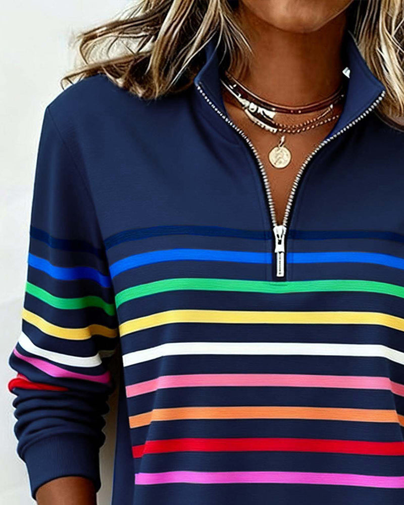 Women’s knit quarter-zip pullover in navy with multicolor striped bands across the chest.
