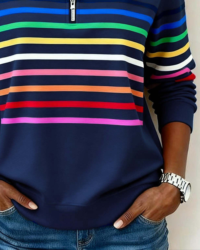Women’s navy knit quarter-zip pullover with multicolor horizontal striped bands and ribbed hem.