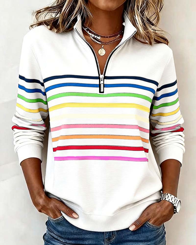 Women’s knit quarter-zip pullover in white with multicolor striped bands on chest and sleeves.