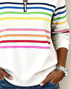 Women’s white knit quarter-zip pullover with multicolor horizontal stripes across the chest.
