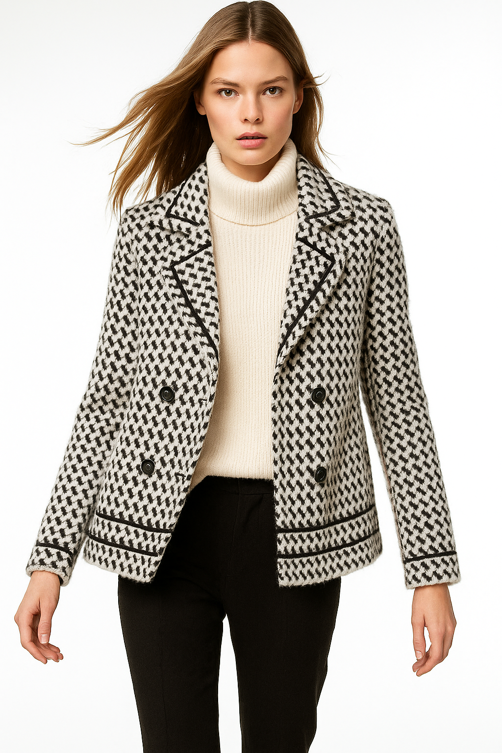 White and black houndstooth knit jacket with double-breasted buttons and ribbed trim.