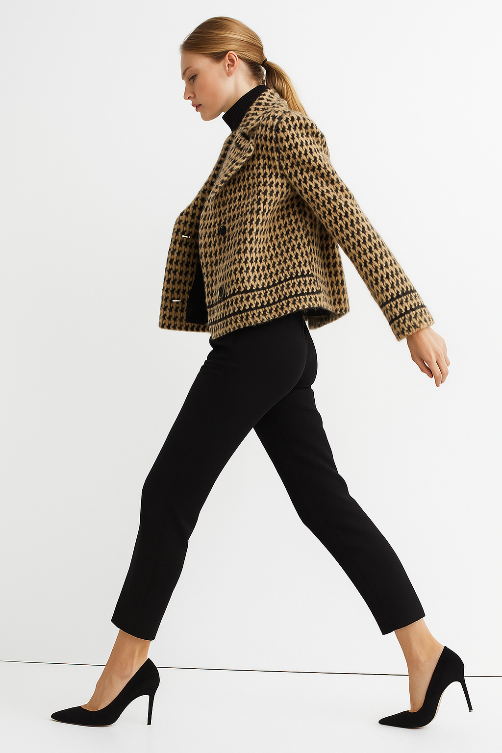 Camel and black houndstooth knit jacket, side view with button cuffs and hem band.